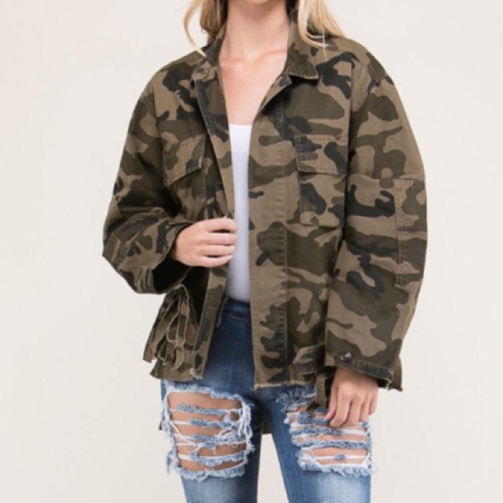 A twist on the camo jacket with fringe and studs